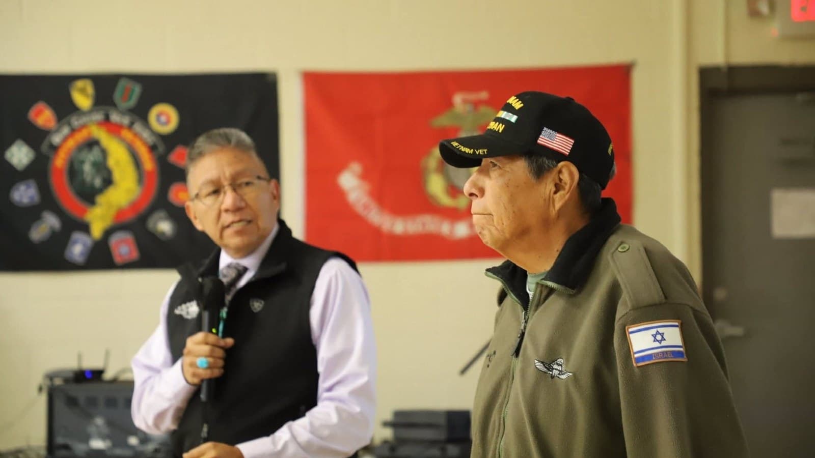 Myron Lizer with community members and veterans